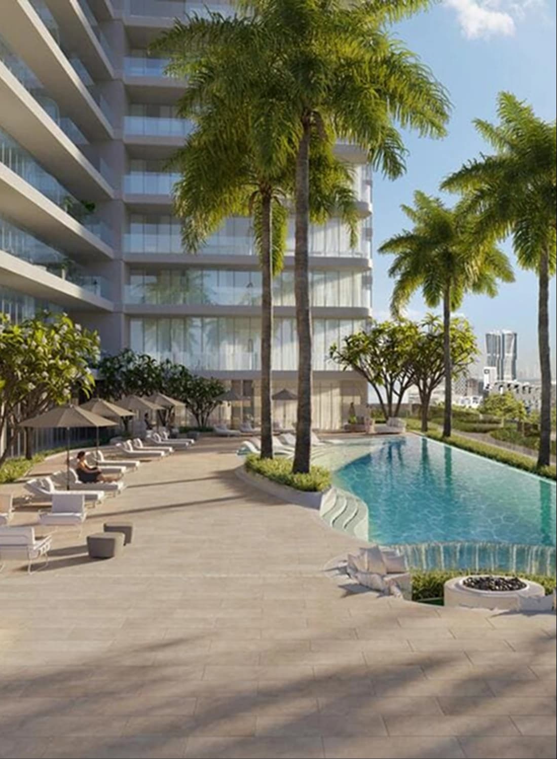 Poolside view with palm trees and modern buildings in the backdrop