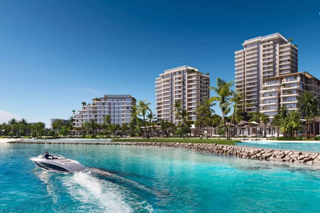 Luxury waterfront residences with boat on turquoise water
