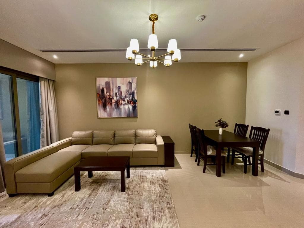Modern living room with a sofa and dining area