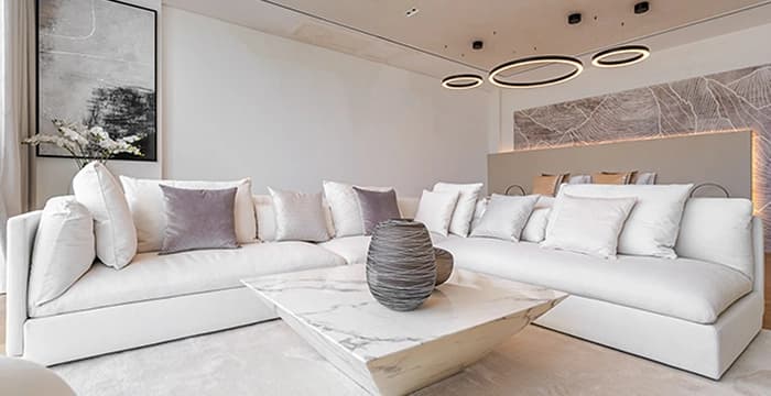 Living room with white sofa and marble table