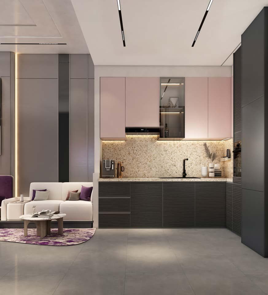 Stylish kitchen with pink cabinetry and modern appliances