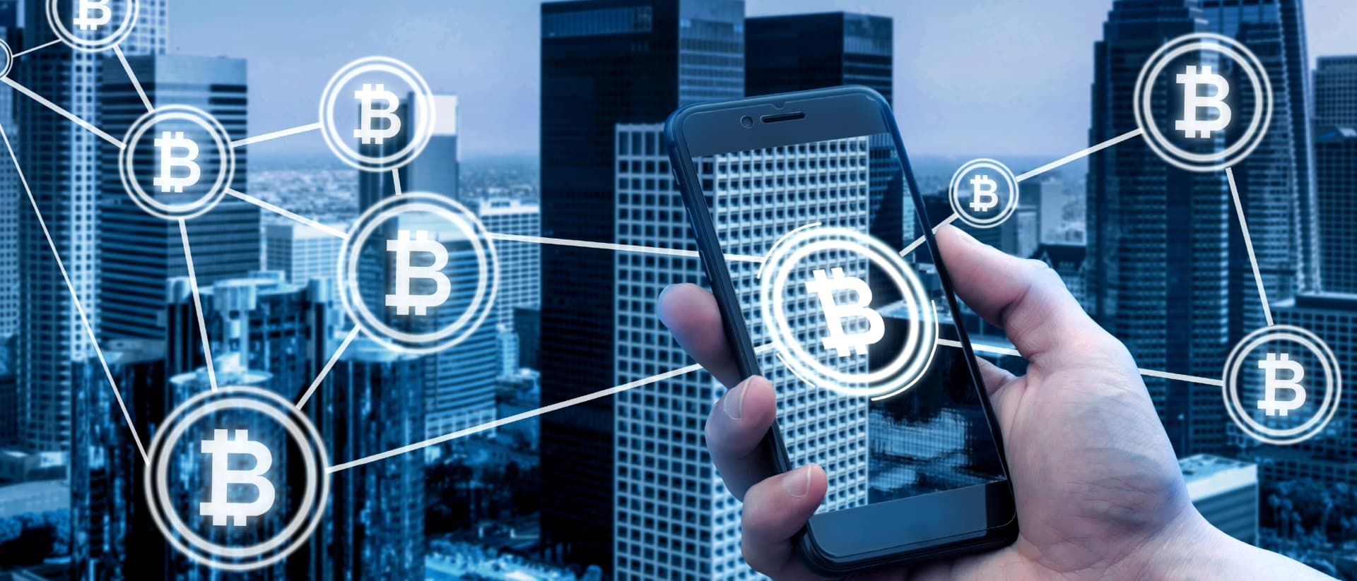 Hand holding phone with Bitcoin network overlay
