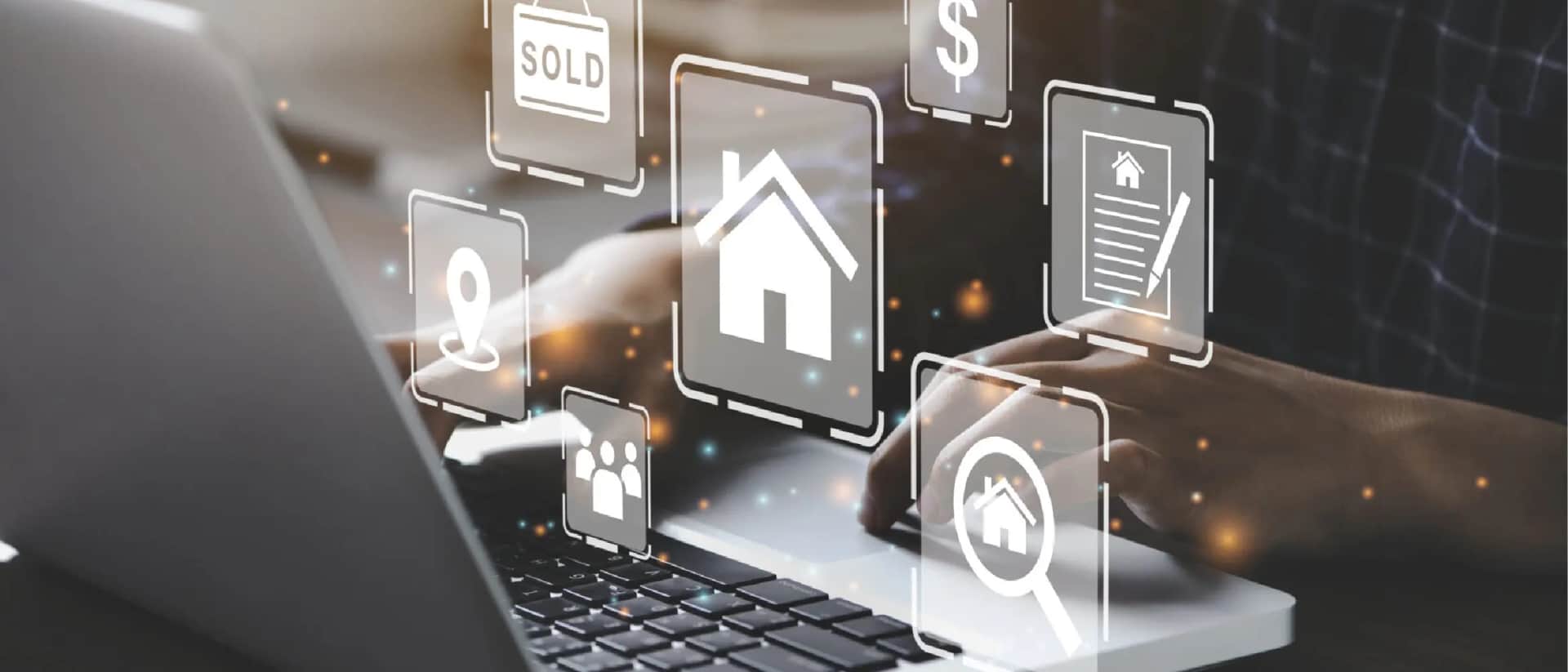 Real estate icons and digital concepts on a laptop screen