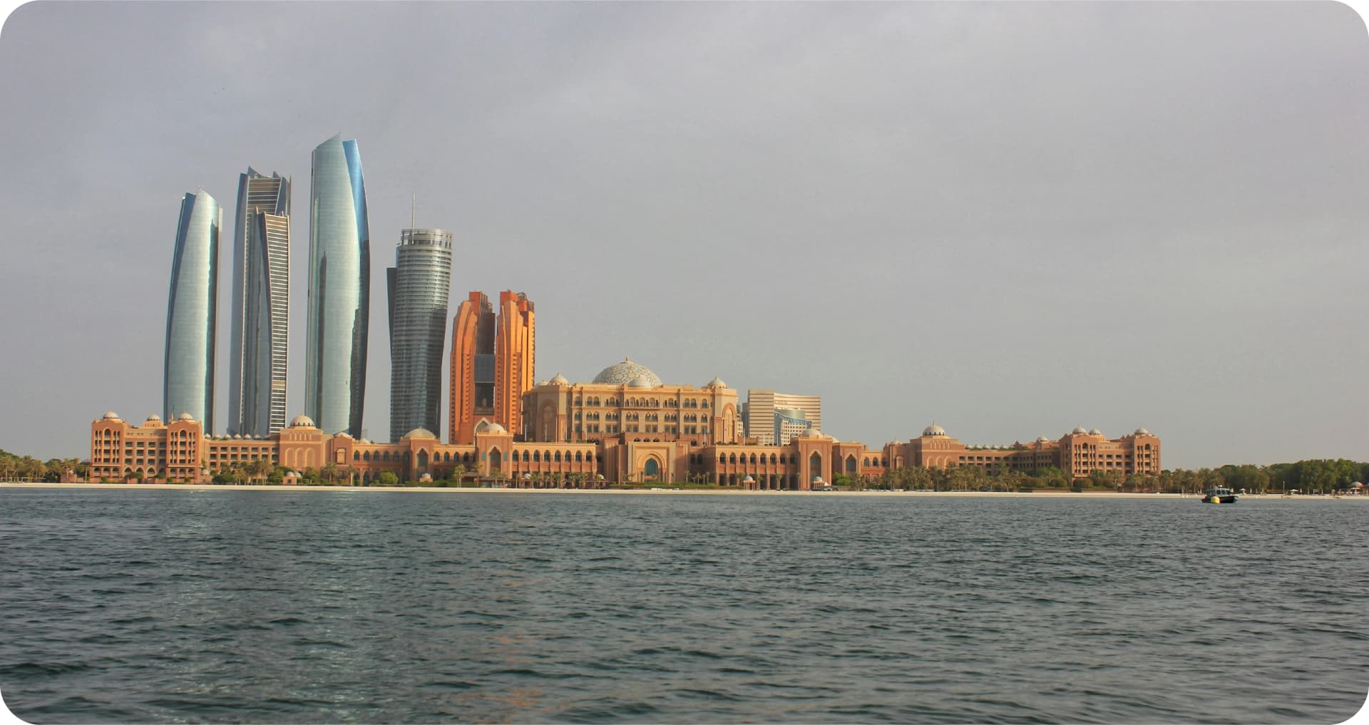 Aerial view of city skyline with modern buildings and a waterfront