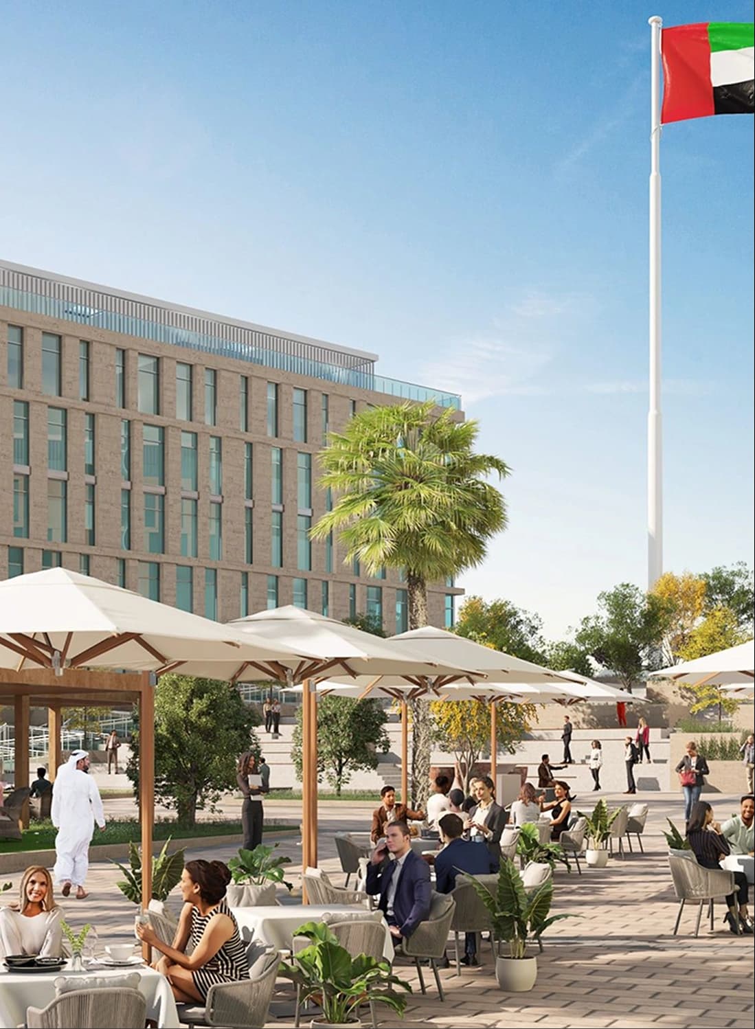 Outdoor dining space with umbrellas and people enjoying a meal
