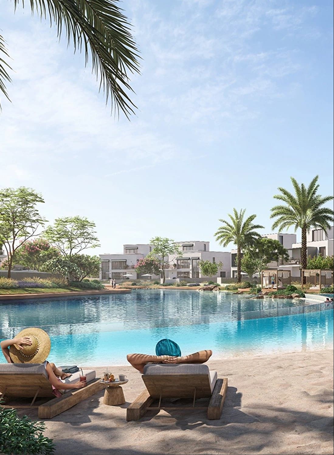Couple relaxing by a scenic lagoon with palm trees