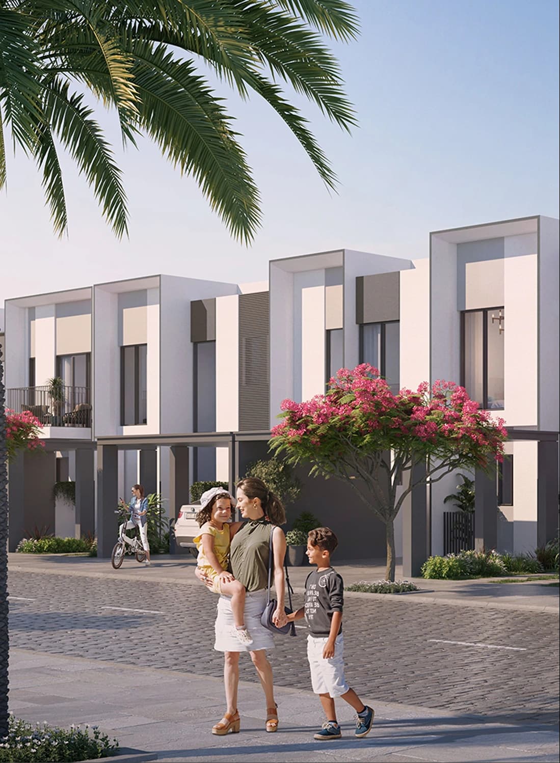 Family walking on modern street with palm trees