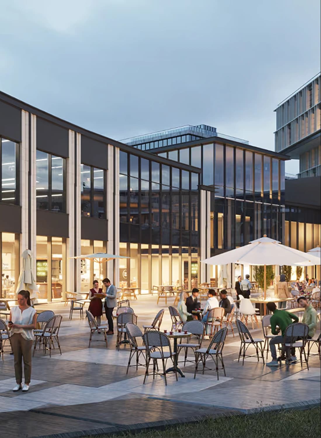 Outdoor dining area at a modern commercial space with people