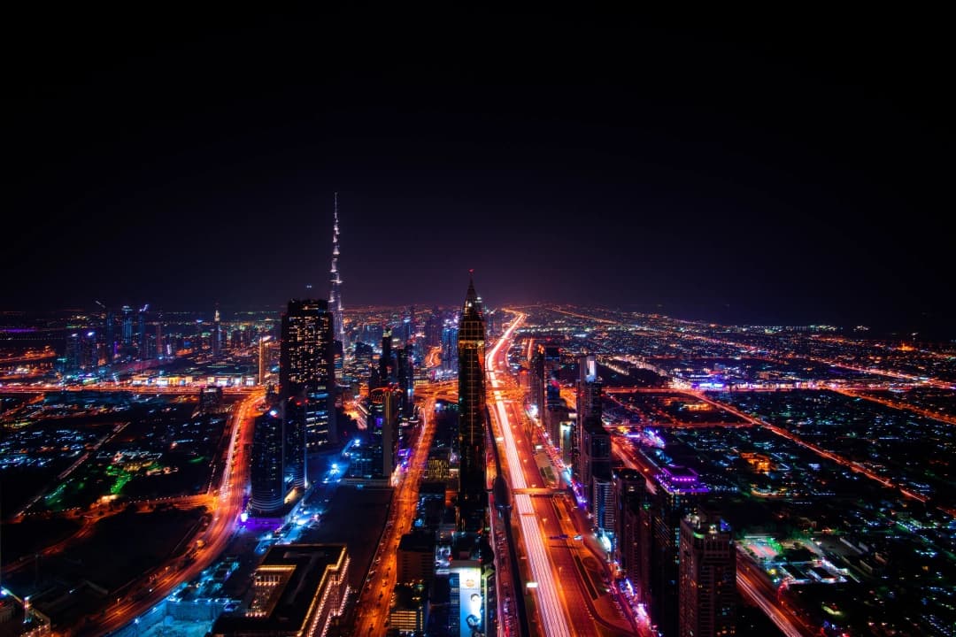 Aerial night view of Dubai with Burj Khalifa illuminated