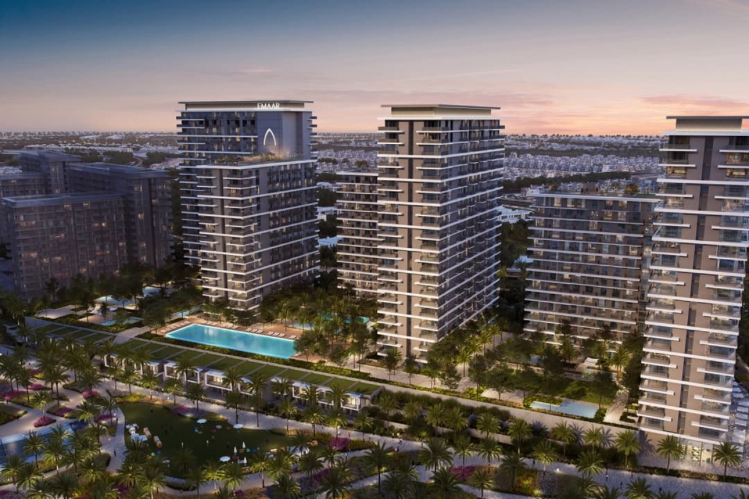 Aerial view of a modern community with pools and gardens