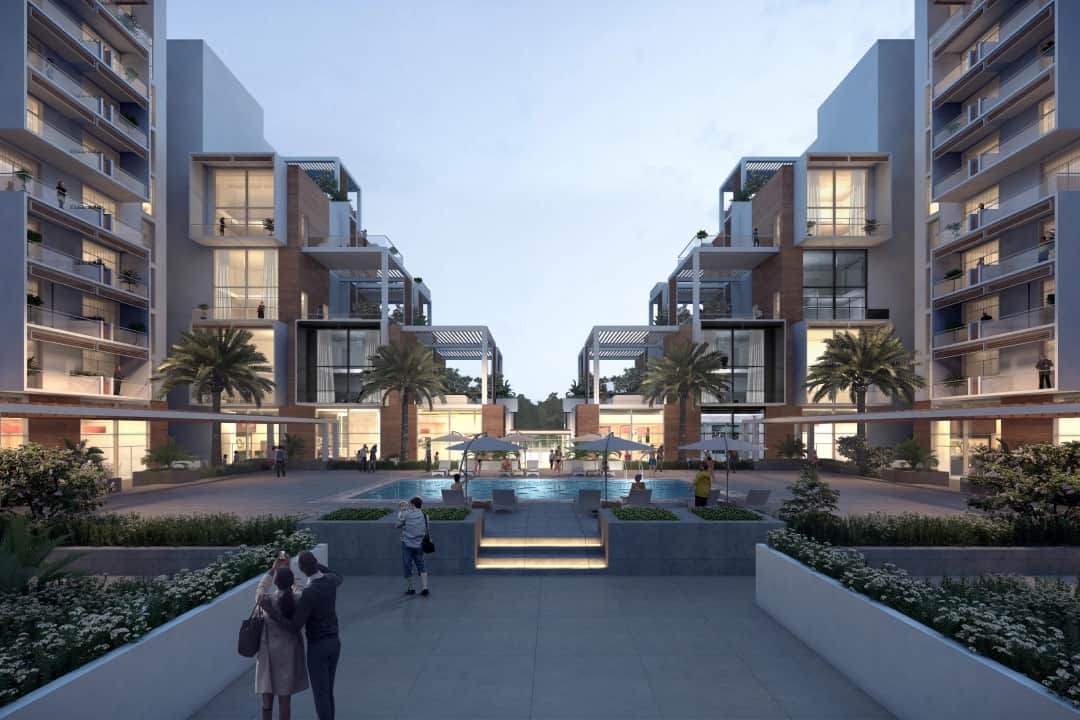 Elegant apartment complex with pool and people enjoying it