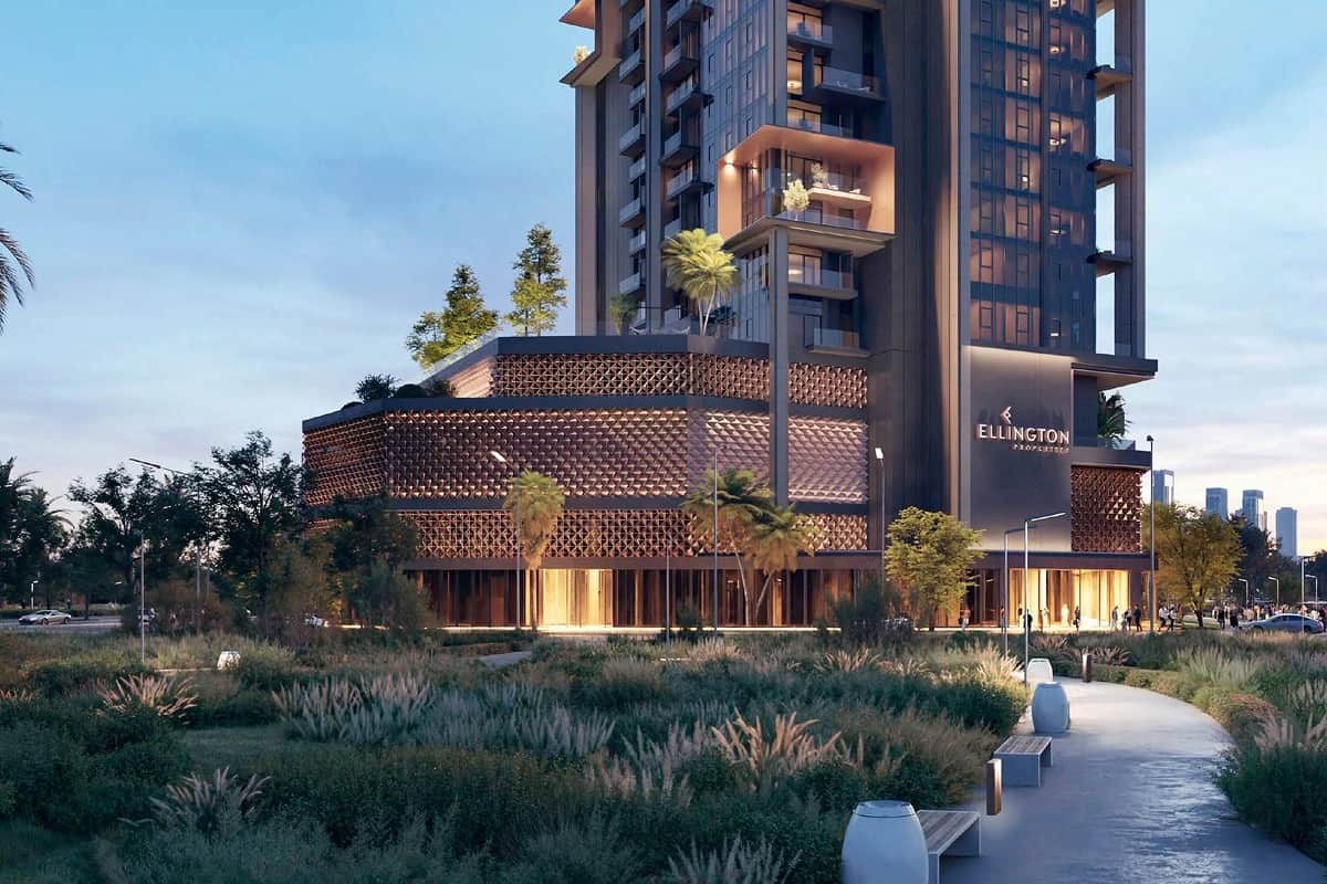 Modern building with intricate design and lush surroundings
