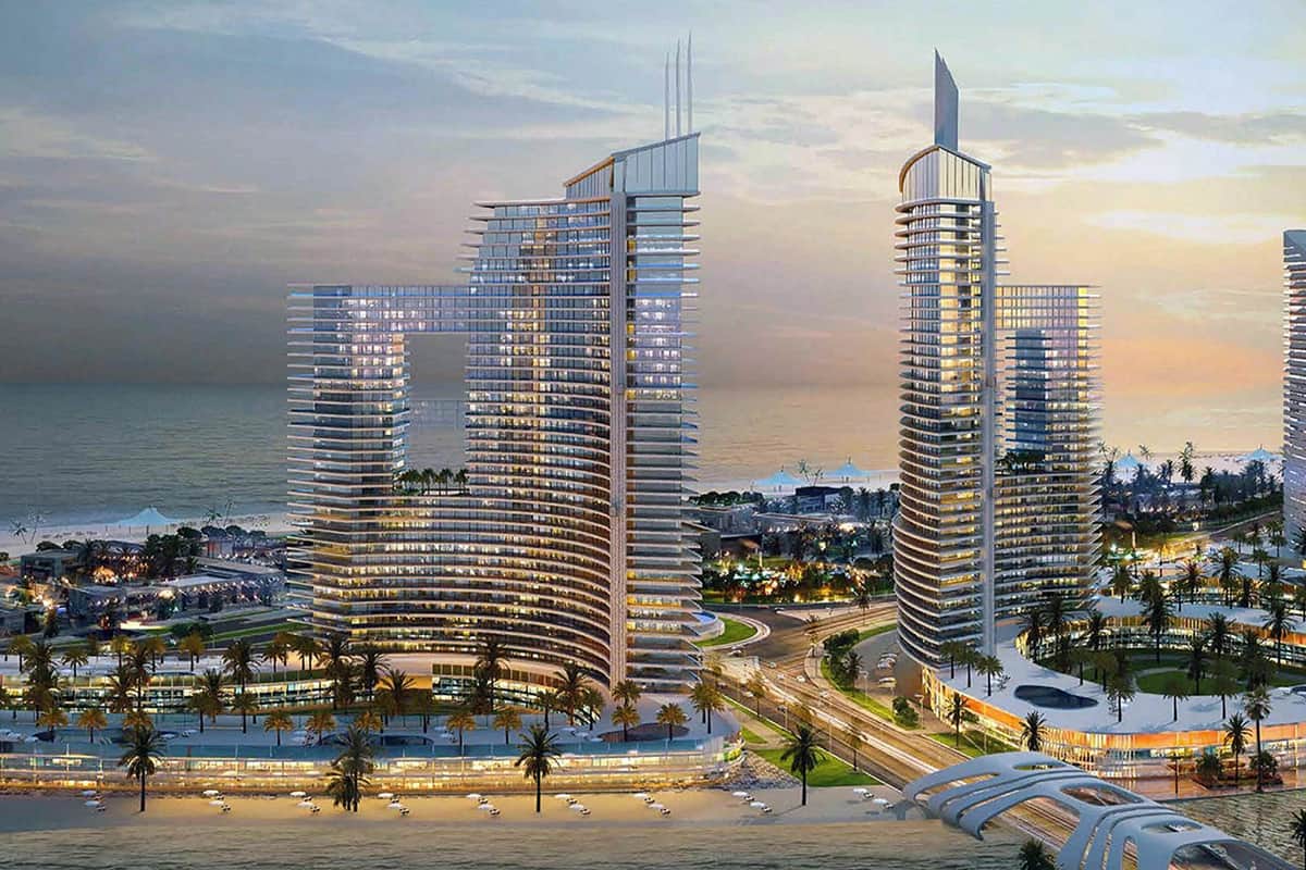 Luxury beachfront development with modern glass buildings