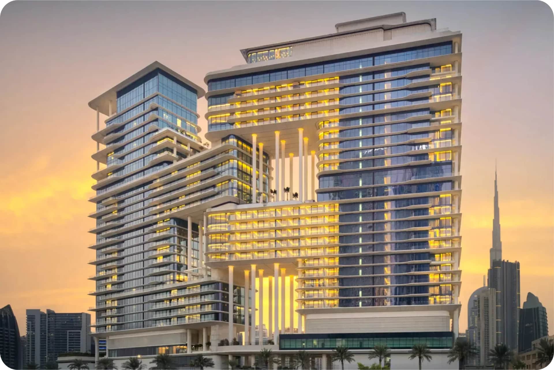 Modern twin towers with sky bridge at sunset