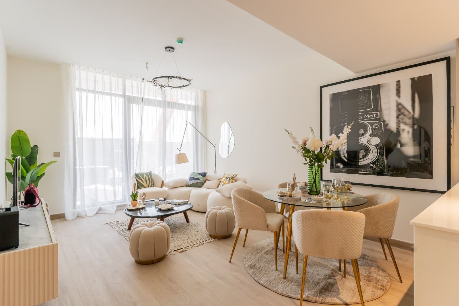 Open living area with dining and wall artwork