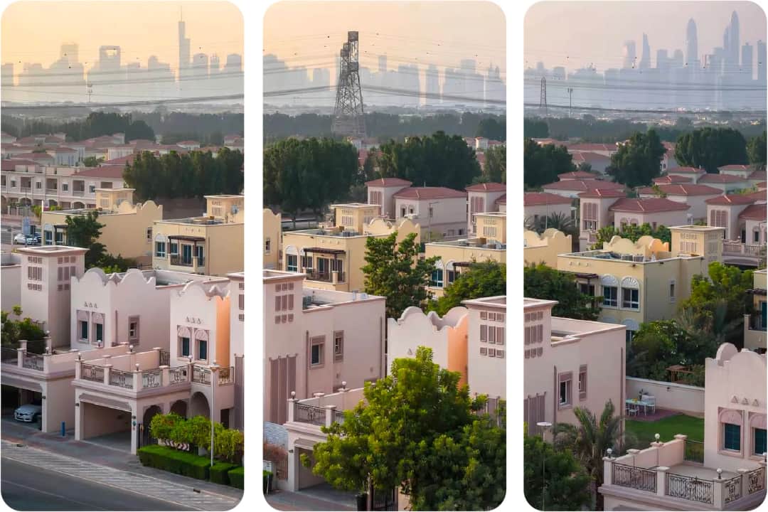 منظر جوي للفيلات مع أفق دبي في الخلفية